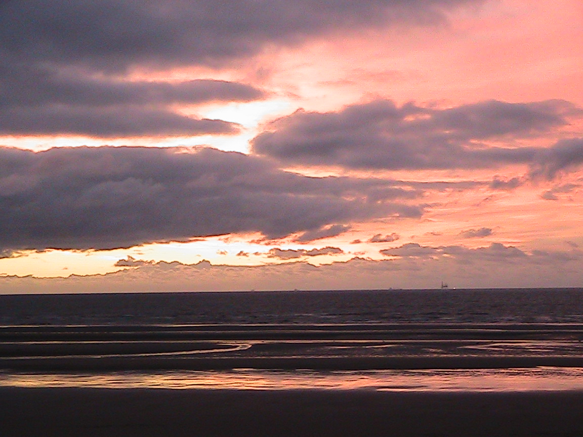 a pink cloudy sunset sky